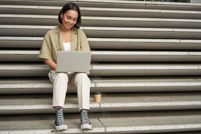 Young woman using mobile phone