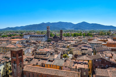 High angle view of townscape against clear blue sky