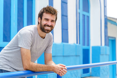 Portrait of young man using mobile phone