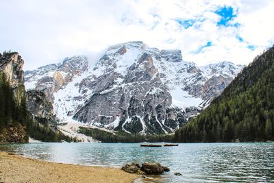 Panoramic view of lake and snowcapped mountains against sky