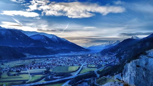 High angle view of snowcapped mountains against sky