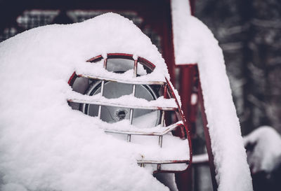 Close-up of snow covering headlight