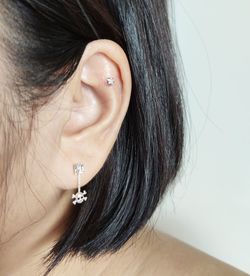 Close-up of woman with hair face against white background