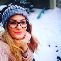 Portrait of smiling woman on snow