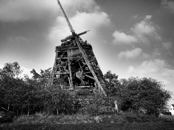 Low angle view of traditional windmill against clear sky