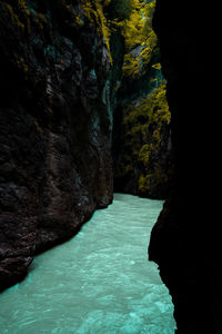 Scenic view of sea seen through cave