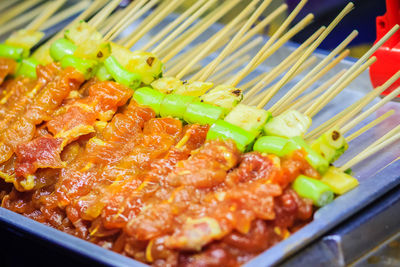 High angle view of meat on barbecue grill