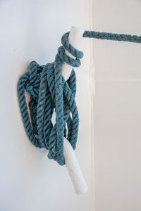 Close-up of rope tied to cleat on boat
