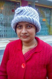 Portrait of beautiful woman in red hat