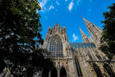 Low angle view of church against blue sky