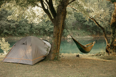 Tent and hammock by the river