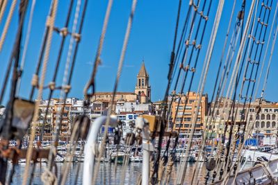 Sail ship detail and small spanish town in costa brava, palamos