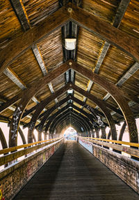 An old wooden bridge for pedestrians over the river in innsbruck in tirol which connects two parts 
