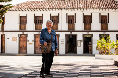 Rear view of woman walking on street