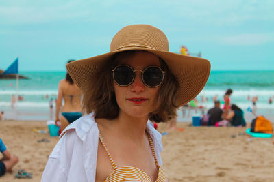 Portrait of man wearing hat on beach