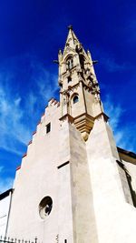 Low angle view of clock tower against sky