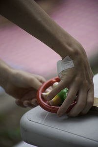 Close-up of hand holding camera