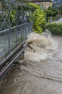 Water flowing over river