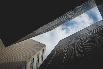 Low angle view of skyscrapers against sky