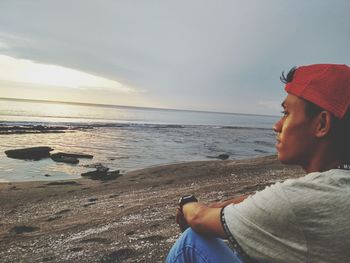 Man looking at sea against sky