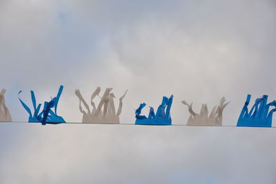 Low angle view of sculptures against sky