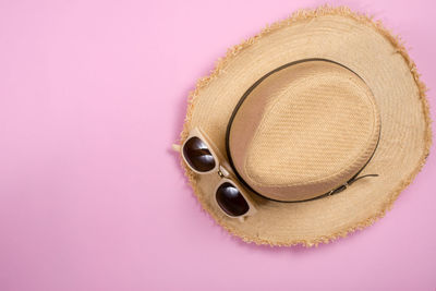 High angle view of hat on pink background