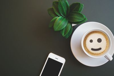 Directly above shot of coffee cup on table