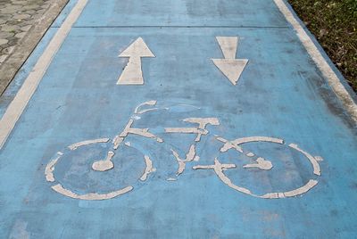 High angle view of bicycle lane sign on road