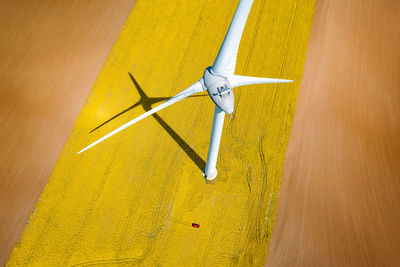 High angle view of wind turbines on field