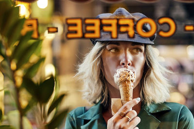 Portrait of woman eating ice cream
