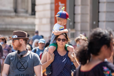 Group of people wearing sunglasses against blurred background