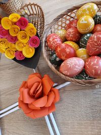 High angle view of multi colored candies in basket on table