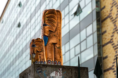 Low angle view of statue against sky