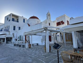 Buildings in city against clear sky