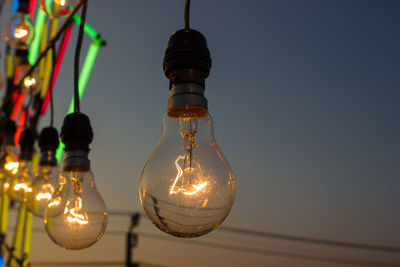 Low angle view of illuminated light bulb