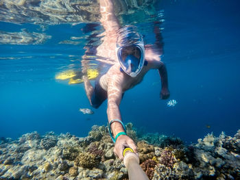 Man swimming in sea