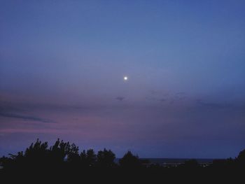 Scenic shot of silhouette trees against sky at dusk