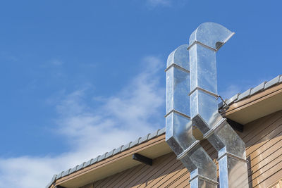 Low angle view of building against blue sky