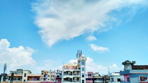 Panoramic view of city against blue sky