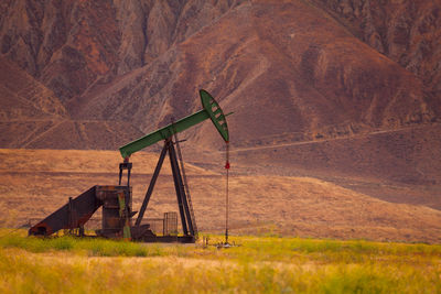 Traditional windmill on field