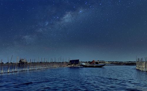 Scenic view of lake at night