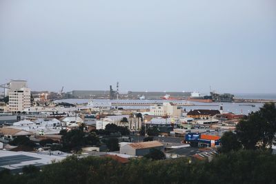 High angle view of buildings in city against clear sky