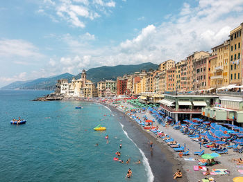 Panoramic view of beach against buildings in city
