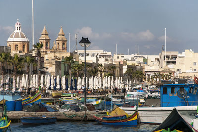 Boats moored at harbor