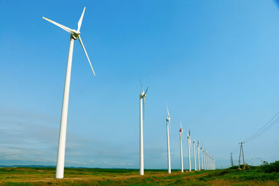 Low angle view of windmill against sky
