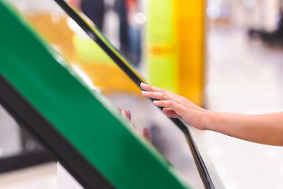 Woman hand uses digital touch screen to get information.