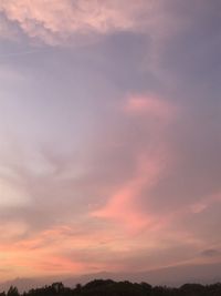 Low angle view of cloudy sky at sunset