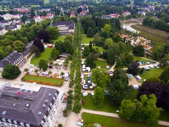 High angle view of street amidst trees in town