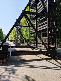 Metal bridge against sky on sunny day