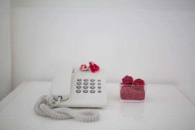 Close-up of red object on table